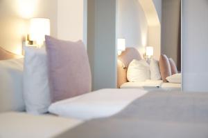 Postel nebo postele na pokoji v ubytování Hotel Ritter Badenweiler