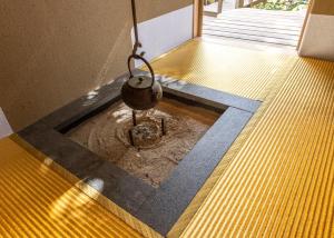 a pot sitting on the floor of a room at Kamakura Base in Kamakura