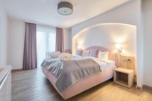 Postel nebo postele na pokoji v ubytování Hotel Ritter Badenweiler