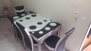a polka dot table and chairs in a kitchen at Lana Apartment in Tbilisi City