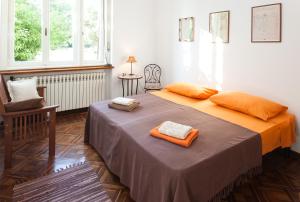 a bedroom with a bed with two towels on it at Apartment Ira in Zadar