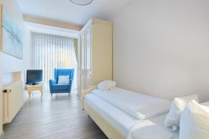 Postel nebo postele na pokoji v ubytování Hotel Ritter Badenweiler