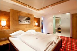 Katil atau katil-katil dalam bilik di Hotel Solaria Ischgl - 4 superior
