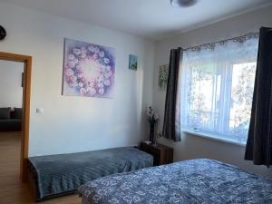 Voodi või voodid majutusasutuse Apartman c.8 Magnolie toas