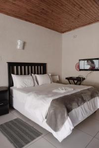 Katil atau katil-katil dalam bilik di Happy Living Guesthouse