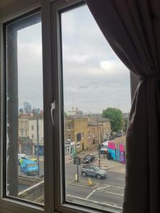 a window with a view of a city street at Marahanata Jadwin 1 BEAUTIFUL 1 BED ROOM FLAT in London