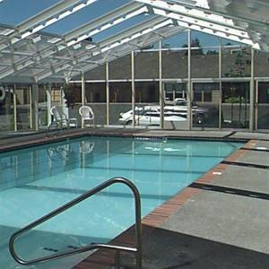 a large swimming pool in a building at Brookings Inn Resort in Brookings