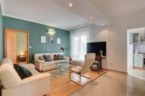 Ein Sitzbereich in der Unterkunft Apartments Villa Delia