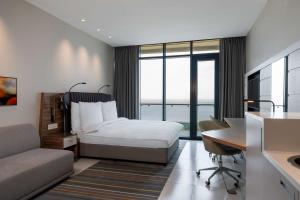 Postel nebo postele na pokoji v ubytování Radisson Blu Hotel & Residence Maputo