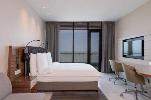 Postel nebo postele na pokoji v ubytování Radisson Blu Hotel & Residence Maputo