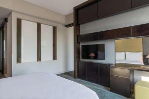 Postel nebo postele na pokoji v ubytování Radisson Blu Hotel & Residence Maputo