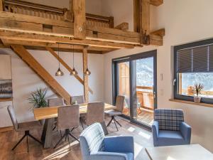 a dining room with a table and chairs at Gasthof Appartements Gamskar in Bad Gastein