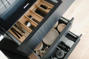 a drawer filled with dishes and utensils at meer suite juist 5 - mit Wattblick in Juist