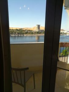 a view from the balcony of a balcony overlooking the water at Philae Hotel Aswan in Aswan