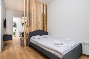 Posteľ alebo postele v izbe v ubytovaní Modern Centrally Located Apartments - by Upstairs