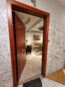 a door leading into a room with a living room at Arman Group in Athens