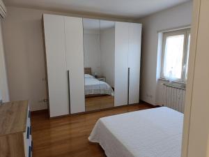 Łóżko lub łóżka w pokoju w obiekcie Gloriapartment