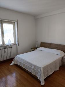 Łóżko lub łóżka w pokoju w obiekcie Gloriapartment