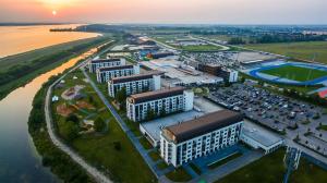 an aerial view of a city with a parking lot at X-BIONIC Hotel in Šamorín