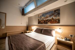 Una cama o camas en una habitación de Hotel Paolo II