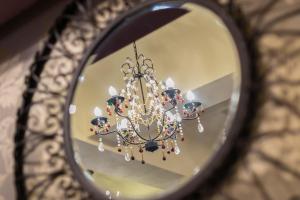 a reflection of a chandelier in a mirror at Skegness The Royal Hotel in Skegness