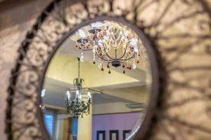 a mirror reflection of a chandelier in a hallway at Skegness The Royal Hotel in Skegness