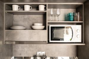 A kitchen or kitchenette at A13 Pristine & Sunny 30m2 flat near Syntagma sq