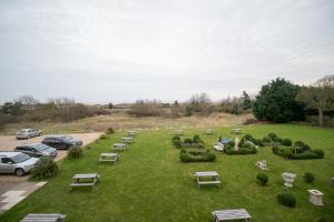 a park with tables and chairs on the grass at Skegness The Royal Hotel in Skegness