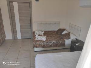 Postel nebo postele na pokoji v ubytování Romeo Beach Hotel