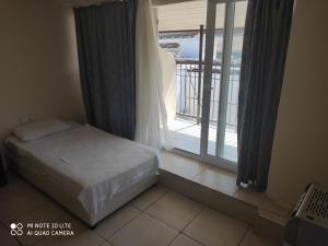 Postel nebo postele na pokoji v ubytování Romeo Beach Hotel