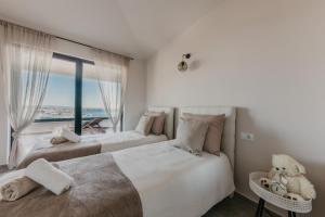 Posteľ alebo postele v izbe v ubytovaní Lux Villa Core with amazing view and heated pool + 37 fotografií