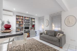 a living room with a couch and a table at Firenze Rentals - Por Santa Maria in Florence