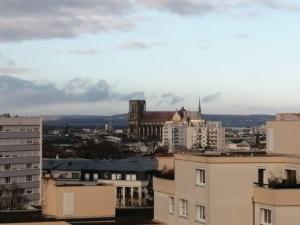 a view of a city with buildings at COULEURS & LUMIERES in Reims