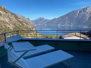 a balcony with a view of a lake and mountains at Un balcone sul Garda New house with panoramic views over Lake Garda in Tremosine Sul Garda