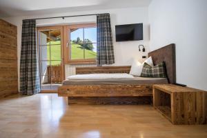 Ένα ή περισσότερα κρεβάτια σε δωμάτιο στο Schoenau Bio & SPA Family Apartments