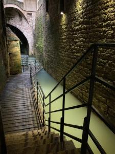 a set of stairs in an old brick building at Les Tiercelines in Dole