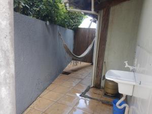 a bathroom with a toilet and a hose in it at Recanto do Sul in Florianópolis
