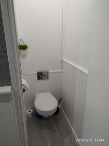 a small bathroom with a toilet in a stall at L'instant Canal in Capestang