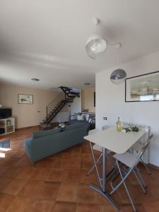 a living room with a couch and a table at Casa Tartaruga in Trarego +14 photos