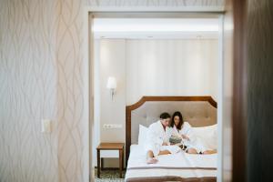 Posteľ alebo postele v izbe v ubytovaní Elixír Medical Wellness Hotel