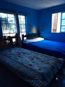 A bed or beds in a room at Casa Familiar Fela