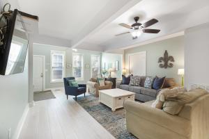 a living room with two couches and a ceiling fan at 118 E ARCTIC UNIT B SALTY SHACK ACROSS THE ST FROM BEACH in Folly Beach
