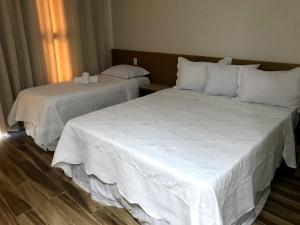 Postel nebo postele na pokoji v ubytování Hotel Reserva do Xingó