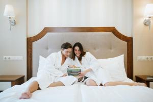 Posteľ alebo postele v izbe v ubytovaní Elixír Medical Wellness Hotel