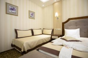 Posteľ alebo postele v izbe v ubytovaní Elixír Medical Wellness Hotel