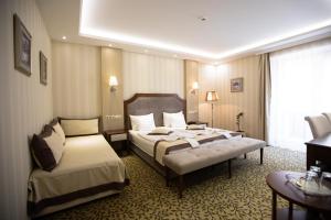 Posteľ alebo postele v izbe v ubytovaní Elixír Medical Wellness Hotel