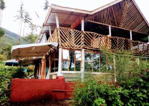 a house that is sitting in the yard at Maverick Camp, Rondavels and Homestay in Nyandarua 
