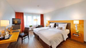Postel nebo postele na pokoji v ubytování Best Western Premier IB Hotel Friedberger Warte