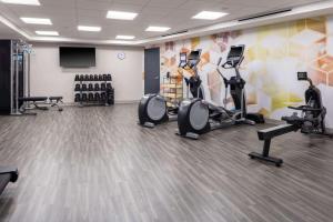 a fitness room with treadmills and cardio machines at Hyatt Place Charlotte University in Charlotte
