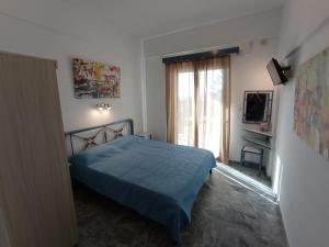 Posteľ alebo postele v izbe v ubytovaní Fengeros Village